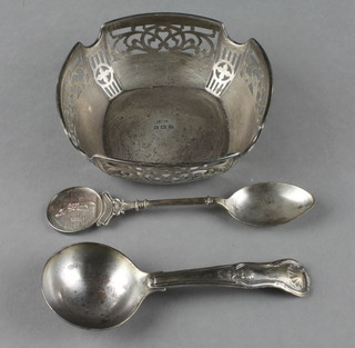 A George IV silver Kings pattern caddy spoon, Birmingham 1822, a silver spoon and bowl 