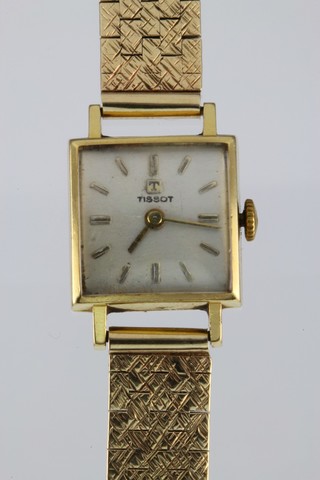 A lady's 18ct gold Tissot wristwatch on a 9ct bracelet 22 grams, 