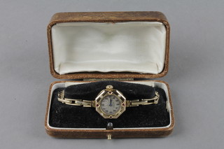 A lady's 14ct gold gem set Rolex octagonal wristwatch on a plated bracelet
