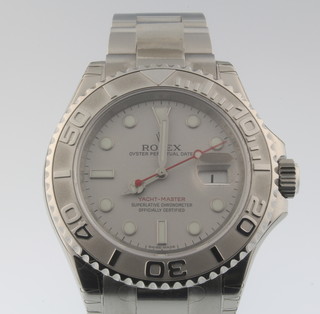 A gentleman's steel cased Rolex Yachtmaster calendar wristwatch on a ditto bracelet with original tag and box