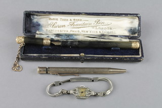 A boxed Swan pen with gilt repousse mounts, a pencil and wristwatch