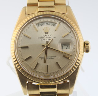 A gentleman's 18ct gold Rolex Oyster perpetual day date wristwatch on a ditto bracelet 