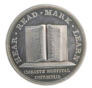 A cased Christs Hospital silver medallion