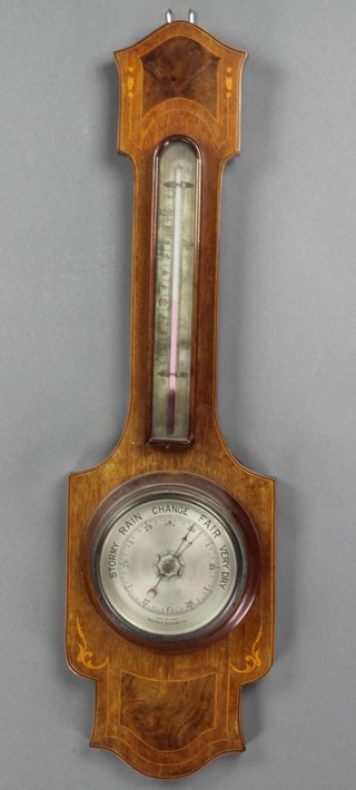 An Edwardian aneroid barometer and thermometer contained in an inlaid mahogany case