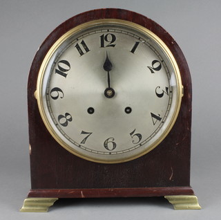 An Edwardian striking bracket clock with silvered dial Arabic numerals contained in an arched mahogany case and raised on brass bracket feet (minute hand missing) 