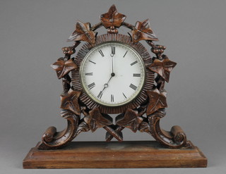 Brevete, a dead beat timepiece with paper dial contained in a carved and pierced oak case 