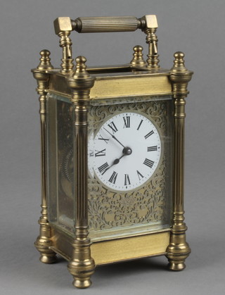 An 8 day carriage clock with circular enamelled dial contained in a gilt metal case, the back plate marked Charles Frodsham 5"h x 3"w x 2 1/2"d