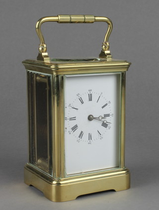 A 19th Century French 8 day carriage clock with enamelled dial, Roman numerals, contained in a gilt metal case 5"h x 3"w x 3"d 