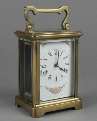 A French 19th Century 8 day carriage clock, the enamelled dial with painted floral swags, the back plate marked R & Co Paris 4 1/2"h x 3"w x 2 1/2"d 