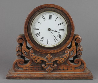 R & Co Paris, a 19th Century French timepiece with enamelled dial and Arabic numerals contained in a carved and pierced oak case