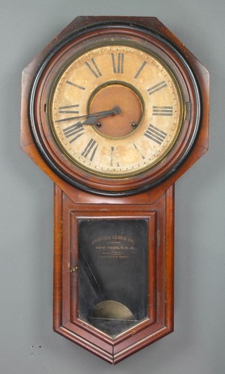 Ansonia, an American drop dial wall clock with 11 1/2" paper dial, Roman numerals contained in a mahogany case 