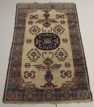 A light blue ground Caucasian style rug with central medallion 82 1/2" x 49"