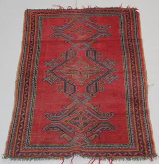 A red ground Turkey rug 62 1/2" x 36", some wear 