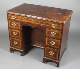 A 19th/20th Century Queen Anne style figured walnut kneehole pedestal dressing table with crossbanded top, fitted 1 long drawer above 6 short drawers, raised on bracket feet, one pedestal fitted a cupboard 29"h x 36"w x 22"d 