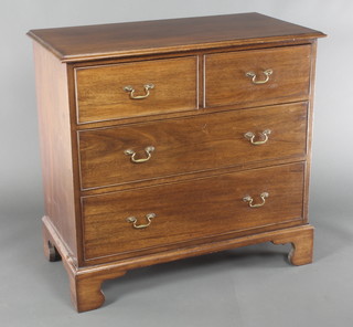 A 19th Century mahogany chest of 2 short and 2 long drawers with swan neck brass handles and raised on bracket feet 34 1/2" h x 36" w x 19" d