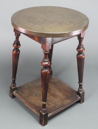 An 18th Century style mahogany occasional table with undertier raised on turned columns and block supports 25" high x 15" diam