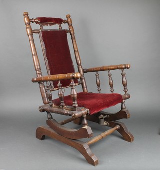 An Edwardian American mahogany childs rocking chair