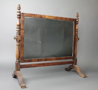 A 19th Century rectangular plate dressing table mirror contained in a mahogany swing frame 22"h x 21 1/2"w 