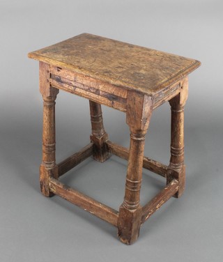 An 18th/19th Century oak joyned stool raised on turned and block supports 19"h x 17"w x 10 1/2" d