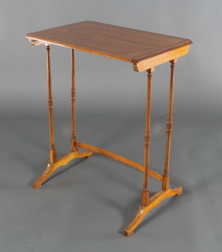 A rectangular satinwood occasional table raised on turned supports 27"h x 22"w x 15"d 