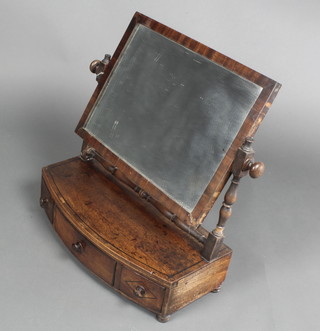 A Georgian rectangular plate dressing table mirror contained in a mahogany swing frame, the bow front base fitted 1 long and 2 short drawers with tore handles 20"h x 19 1/2"h x 9 1/2"d