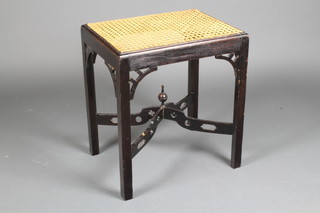 A Chippendale style ebonised dressing table stool with pierced X framed stretcher, raised on turned supports 20"h x 18"w x 13"d