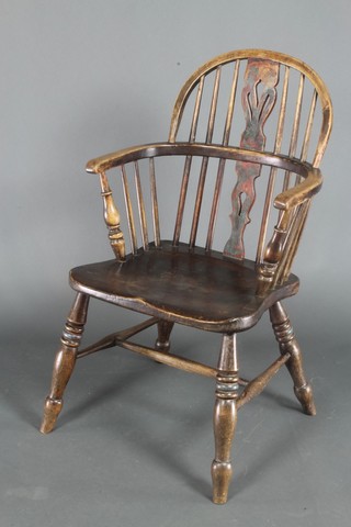 A 19th Century elm stick back carver chair with solid seat and H framed stretcher 