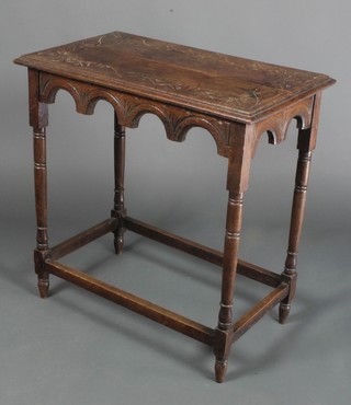 A Victorian rectangular carved oak occasional table with shaped apron, raised on turned and block supports 29"h x 28"w x 17"d