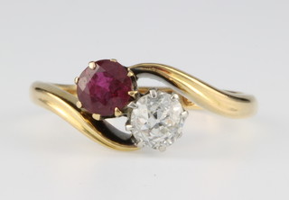 An 18ct yellow gold ruby and diamond cross-over ring, each approx 0.4ct, size L