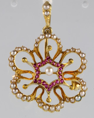 An Edwardian 15ct yellow gold seed pearl and gem set open brooch 