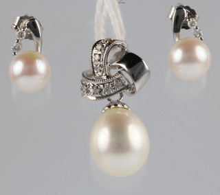 A pair of 18ct white gold diamond and pearl ear studs together with a ditto pendant 