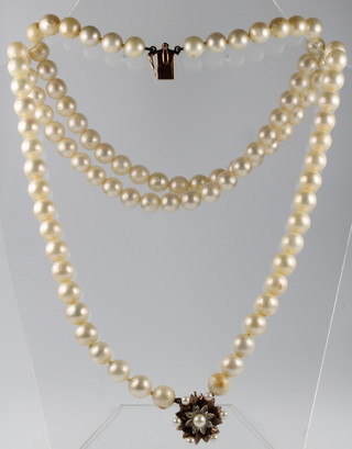 A string of cultured pearls with a 9ct diamond and pearl 2 colour clasp 32"