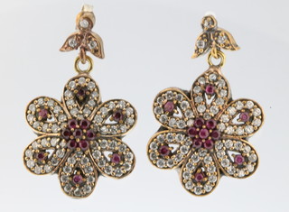 A pair of silver gilt gem set earrings
