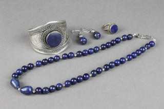 A modern lapis lazuli bead necklace 20", a pair of ensuite earrings, a ring and bracelet