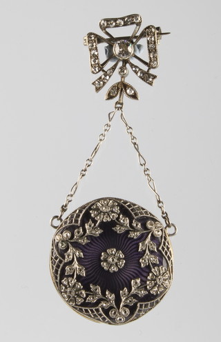 A lady's guilloche enamelled and diamond set fob watch on a diamond ribbon clasp