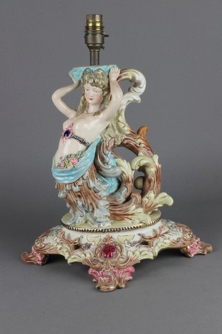 A Continental Majolica lamp base in the form of a mermaid on a raised Rococo base 