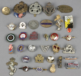A collection of badges including second world war etc 