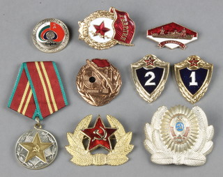 A collection of modern ration enamel badges