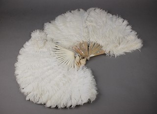 A mother of pearl ostrich fan and one other 