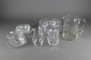 A cut glass water jug with floral decoration and minor table glassware 