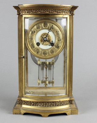 A 19th Century French 8 day 4 glass mantel clock with gilt dial, Arabic numerals and twin mercurial pendulum, contained in a gilt metal bow front case, the top is loose  