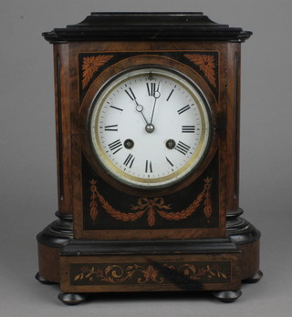 A Continental 8 day striking bracket clock with enamelled dial and Roman numerals contained in a shaped inlaid mahogany case 