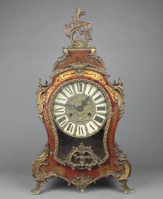A German striking mantel clock contained in a red bulle case with Roman numerals (door f)