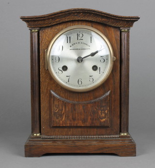P. Orr & Sons Ltd, Madras and Rangoon, an early 20th Century oak mantel clock, having silvered dial with Arabic numerals and outer minute track, flanked by column supports and set 8 day movement chiming gong, 11"h x 9"w
