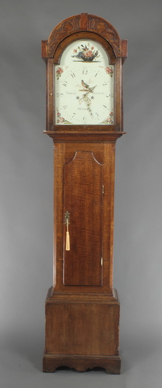 Thomas Morpeth of Hexham, an 18th Century 30 hour longcase clock with 12" arched painted dial decorated a basket of birds with fruit and floral spandrels, having a calendar aperture and contained in an oak case 79"