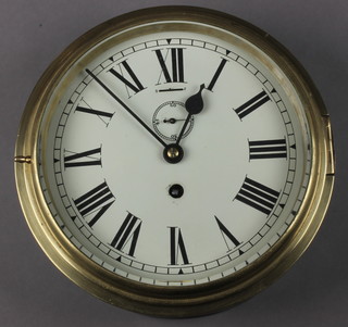 A ward room clock with painted dial, Roman numerals, subsidiary second hand, contained in a brass case 8" 