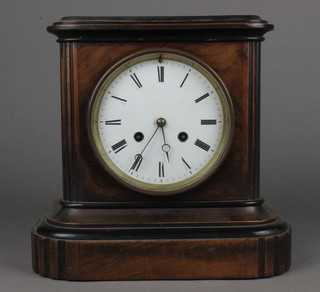 A Victorian walnut and parcel ebonised mantel clock having an enamelled dial with Roman numerals, set an 8 day cylinder movement and chiming gong, 9.5"h x 10"w x 6.5"d 