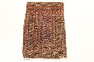 A red ground Bokhara rug with 6 diamonds to the centre 43" x 25 1/2" 