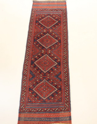 A red and blue ground Meshwani runner with 4 diamonds to the centre 92"l x 24"w 
