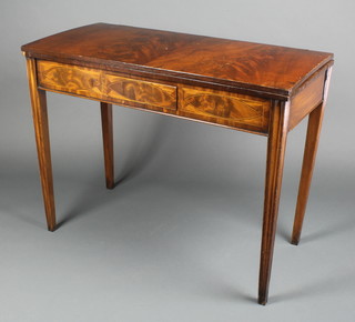 A 19th Century rectangular mahogany tea table, the apron inlaid ebony and satinwood stringing, raised on square tapering supports 28 1/2"h x 37"w x 18"d 